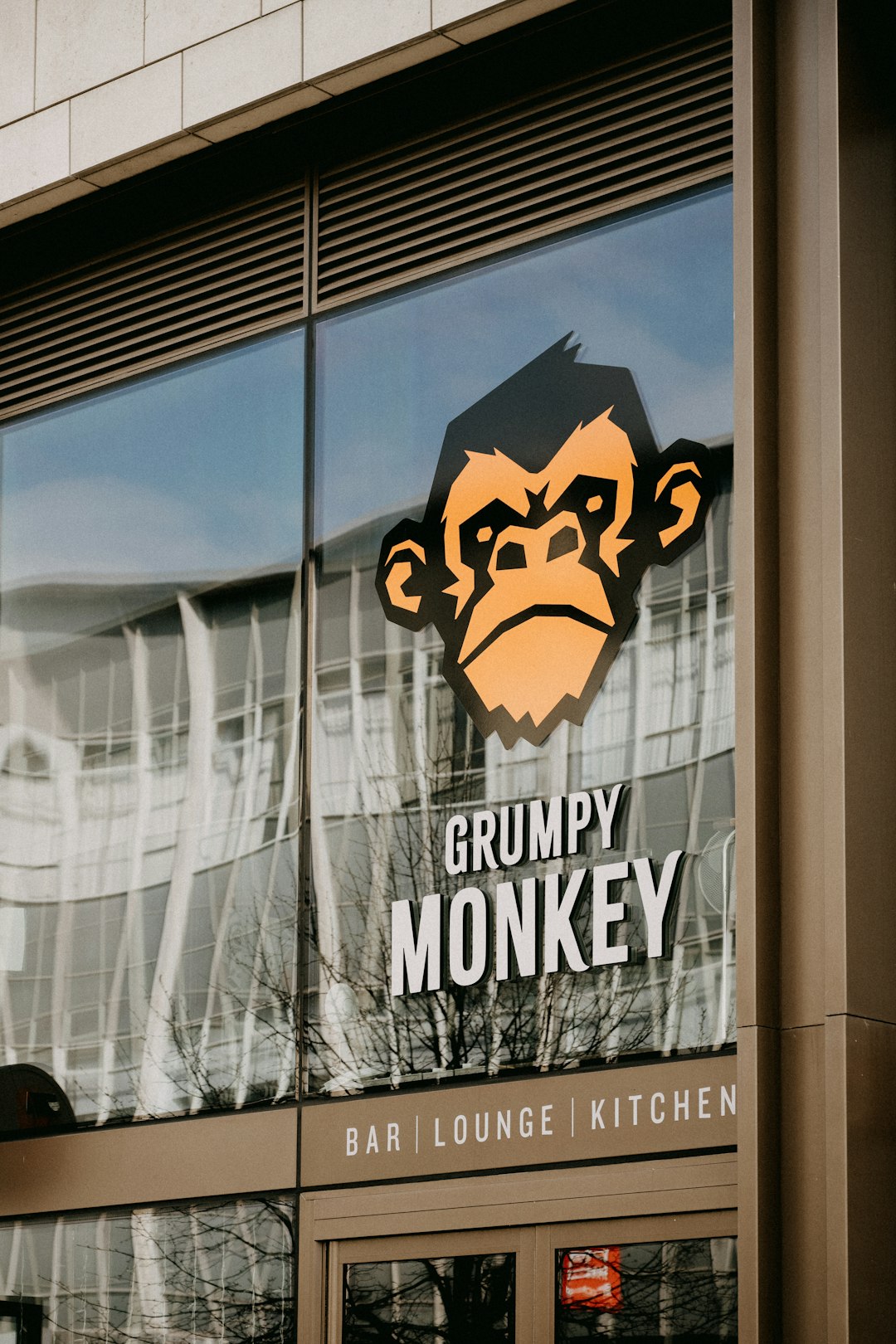 services-03 a-monkey-is-reflected-in-the-window-of-a-restaurant-yvzr-spcstq